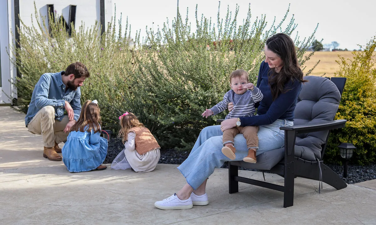 Family relaxing in their back yard