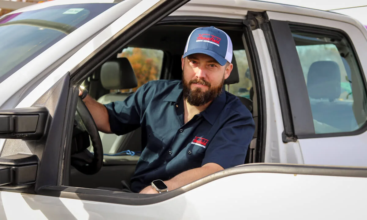 HomeField technician seated in a service truck